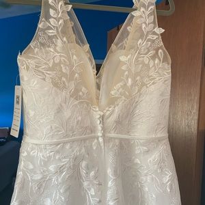Beautiful Lavetir white lace silk wedding dress- size 16. Never worn.